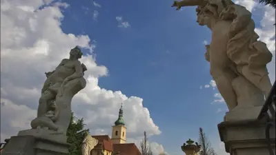 a couple of statues in front of a building at Apartment Sedlčanská - You Will Save Money Here - equipped with antique furniture in Prague