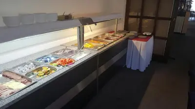 a buffet line with many different types of food at Hotel ELMA in Srbsko