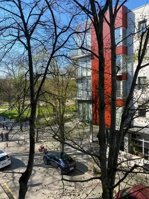 a car parked in a parking lot in front of a building at Apartment Spa and Fontain Poděbrady in Poděbrady