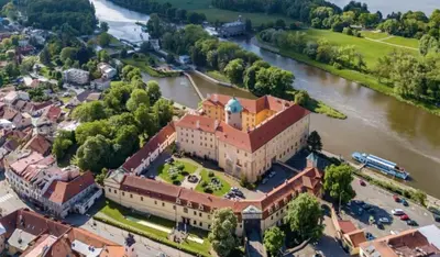 an aerial view of a large building next to a river at Apartment Spa and Fontain Poděbrady in Poděbrady