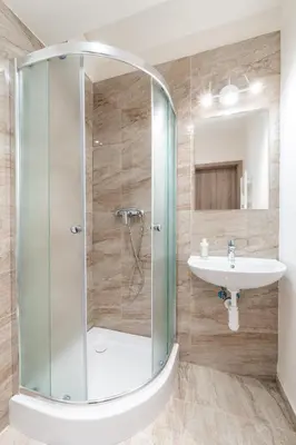 a bathroom with a shower and a sink at Studio brand new apartment #28 in new building with free parking in city center in Prague