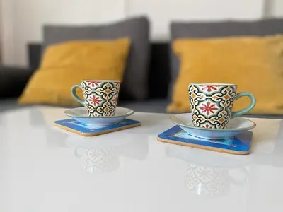 two coffee cups sitting on top of a table at Apartmán - F - Vyhlídka nad řekou in Zdiby