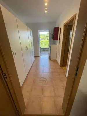 a hallway of a house with a tile floor at Letní dům Ždáň in Slapy