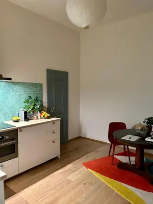 a kitchen with a table and a dining room at Green balcony & king size bed in Prague