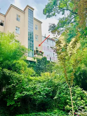 a building with a red arrow on the side of it at Green balcony & king size bed in Prague
