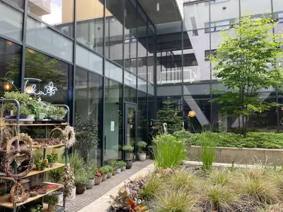 a glass building with plants in front of it at Apartment Karel with garage parking in Prague