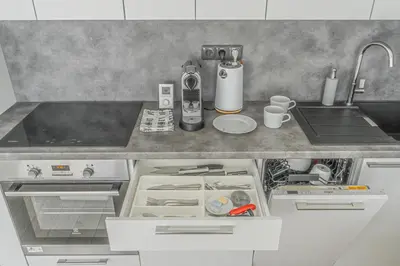 a kitchen with a sink and a counter top at Apartment Karel with garage parking in Prague