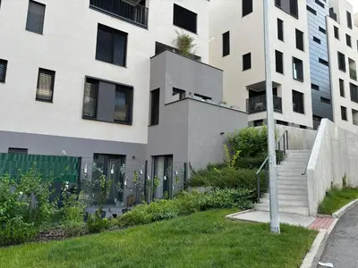 an apartment building with a lawn in front of it at Apartment Dagmar Burešové in Prague