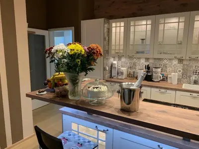 a kitchen with a vase of flowers on a counter at Apartment Dagmar Burešové in Prague