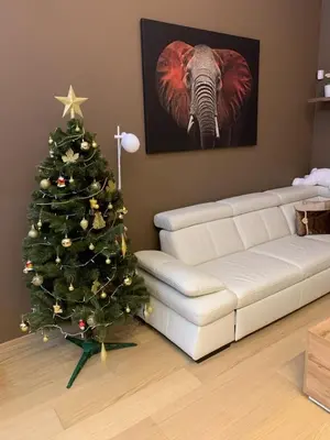 a living room with a christmas tree and an elephant at Apartment Dagmar Burešové in Prague
