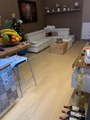 a living room with a couch and a table with fruit on it at Apartment Dagmar Burešové in Prague