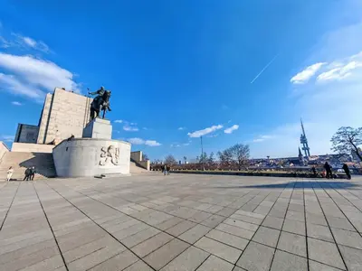 a statue in a square with a blue sky at Flat in Zizkov -101- in Prague