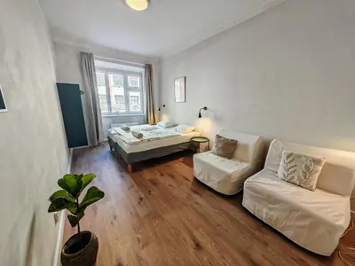a living room with a couch and a bed at Flat in Zizkov -102- in Prague
