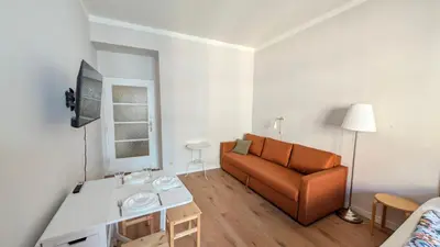 a living room with a couch and a table at Apartment in Zizkov -202- in Prague