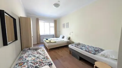 a room with two beds and a window at Apartment in Zizkov -202- in Prague