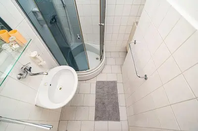 a bathroom with a toilet and a shower at Apartment in Zizkov -203- in Prague