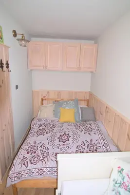 a small bedroom with a bed in a room at Bouda Berounka in Lety
