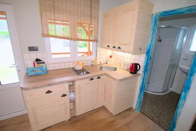 a small kitchen with a sink and a refrigerator at Bouda Berounka in Lety