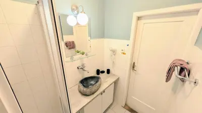 a bathroom with a sink and a mirror at Flat in Zizkov -204- in Prague
