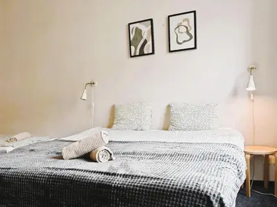 a bedroom with a bed with a stuffed animal on it at Flat in Zizkov -303- in Prague