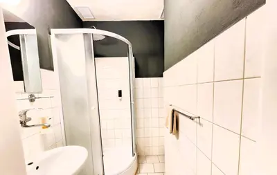 a small bathroom with a toilet and a sink at Flat in Zizkov -303- in Prague
