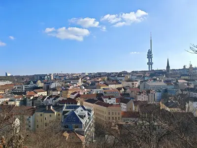 a view of a city with a tower in the background at Flat in Zizkov with free underground parking -501- in Prague