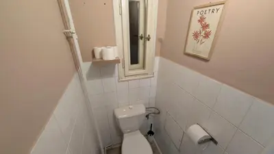 a small bathroom with a toilet and a mirror at Flat in Zizkov with free underground parking -501- in Prague