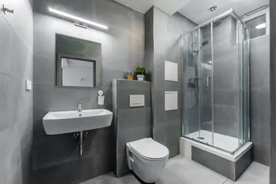a bathroom with a sink toilet and a shower at Rentero Wenceslas square Apartment, Prague in Prague