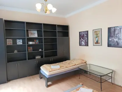 a room with a bed and a glass table at Rooms in the Center of Old Town in Prague