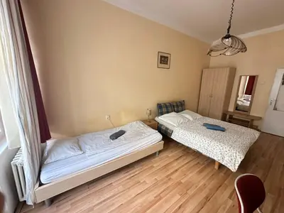 a bedroom with two beds in a room at Rooms in the Center of Old Town in Prague