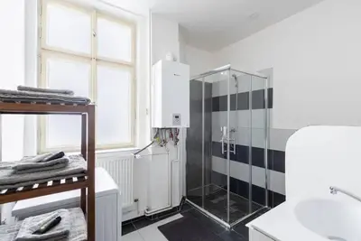 a bathroom with a shower and a sink at Spacious apartment with balcony at Wenceslas Sq in Prague
