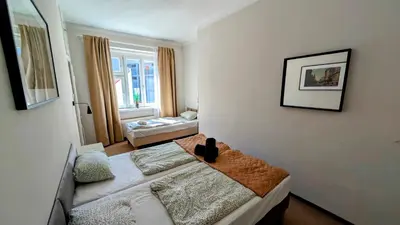 a small room with a bed and a window at Flat in Zizkov -401- in Prague
