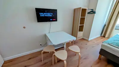 a small room with a table and two chairs at Flat in Zizkov -401- in Prague