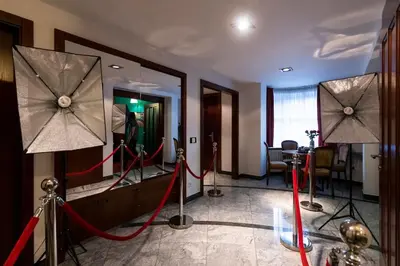 a dressing room with two mirrors and red ribbon at Private Hostel Casino Royal in Prague