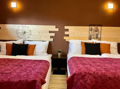 two beds sitting next to each other in a room at Private Hostel Casino Royal in Prague