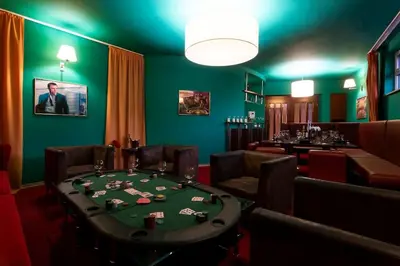 a poker room with a poker table and chairs at Private Hostel Casino Royal in Prague