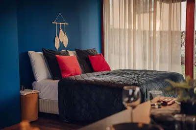a bedroom with a bed with colorful pillows at Marvel 2BD Apartment in modern villa with cozy terrace in Prague