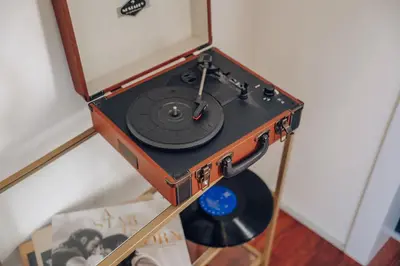 a record player with a cd inside of it at Design 3BD apartment cooking area in architect villa in Prague