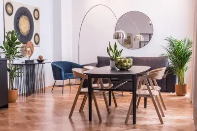 a dining room with a table and chairs and a mirror at New design APT - central location Wenceslas Square in Prague
