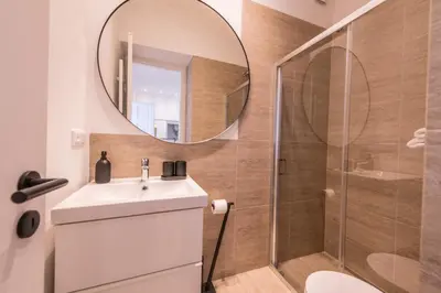 a bathroom with a sink and a mirror at New design APT - central location Wenceslas Square in Prague