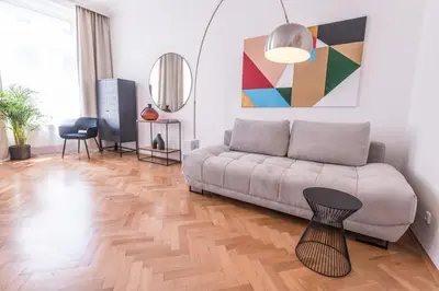 a living room with a couch and a table at New design APT - central location Wenceslas Square in Prague
