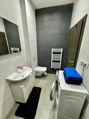 a white bathroom with a sink and a toilet at Byt apartman 2rooms 76m2 all new in Prague