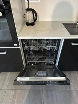 a dishwasher with its door open in a kitchen at Byt apartman 2rooms 76m2 all new in Prague
