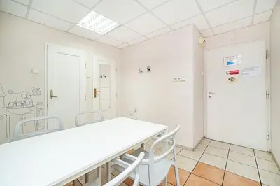 a white room with a table and chairs at 3 bedroom flat with amazing terrace in Prague