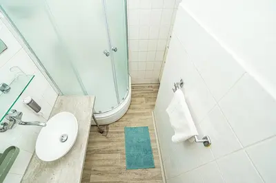 a bathroom with a sink and a shower at 3 bedroom flat with amazing terrace in Prague