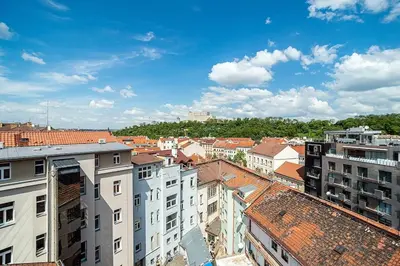 an aerial view of a city with buildings at Bright 2 bed with big terrace by tram in Prague