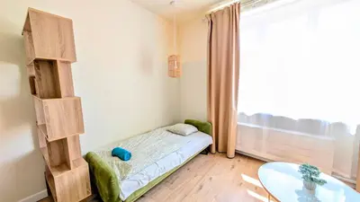 a small room with a small bed and a table at Apartment in Zizkov -504- in Prague