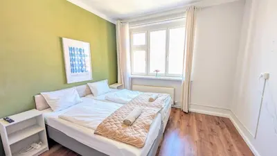 a bedroom with a bed in a room with a window at Flat in Prague -503- in Prague