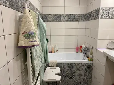 a small bathroom with a tub and a sink at Ubytování u babičky in Peruc