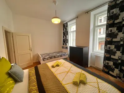 a bedroom with a bed with bananas on it at Amazing Apartment Zborovska in Prague